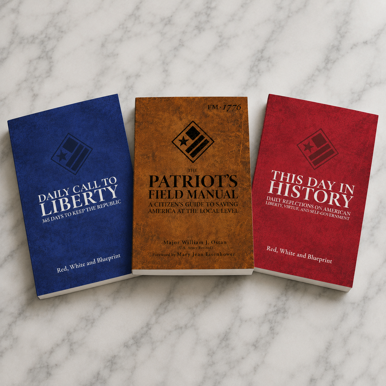 The Patriot's Field Manual, This Day in History, and Daily Call to Liberty books fanned on marble